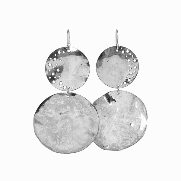 Silver Penumbra Earrings—handcrafted high-polish sterling silver medallions with fluid sculptural form by Elke Van Dyke.