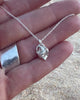 Video of Coração Heart Necklace – Handmade Sterling Silver Anatomical Heart Pendant Necklace by Elke Van Dyke, shown in palm of hand for scale.
