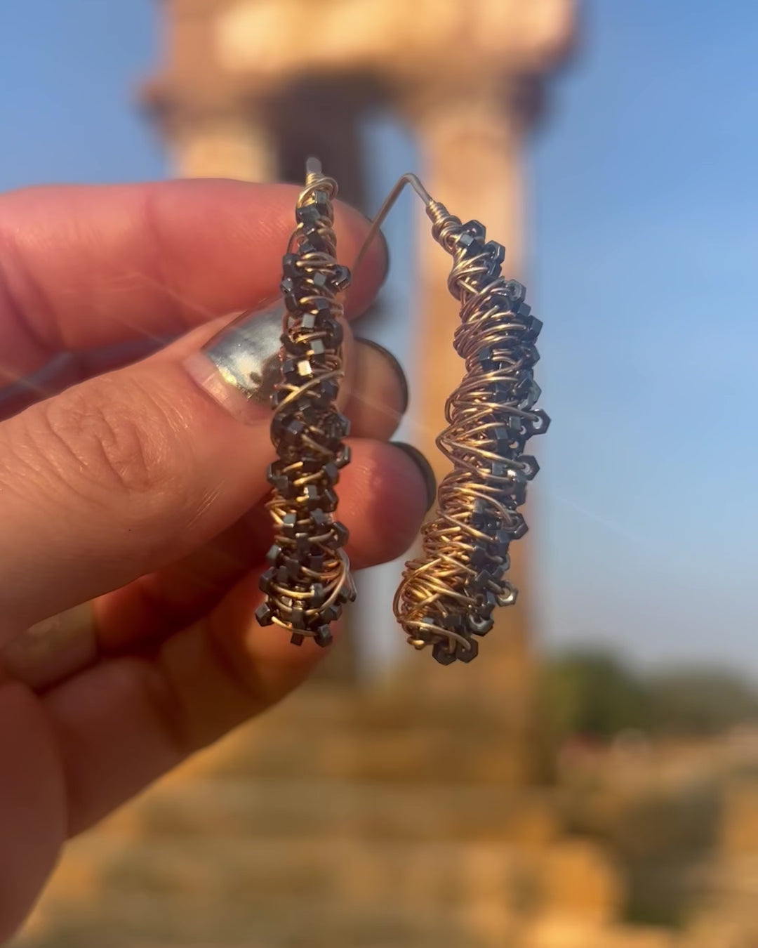 Medium Gold Cocoon Earrings, handcrafted by Elke Van Dyke with 14K gold fill and faceted hematite stones.