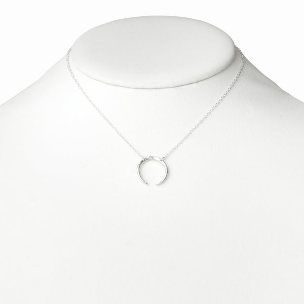 Elke Van Dyke Design Silver Crescent Moon Necklace on mannequin neck