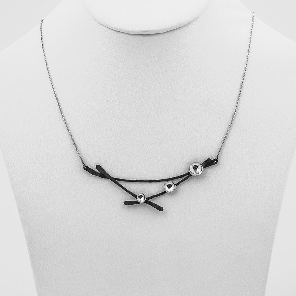 Elke Van Dyke Design Black Oxidized Moon Lapse Necklace on mannequin neck