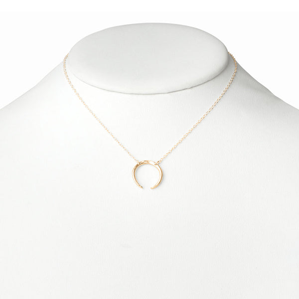 Elke Van Dyke Design Gold Crescent Moon Necklace on mannequin neck