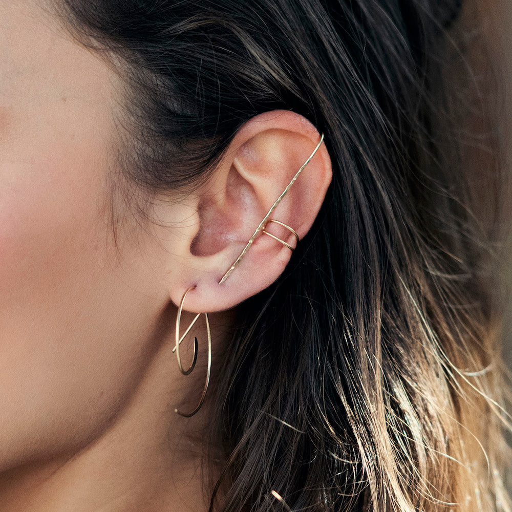 Elke Van Dyke Sterling Silver Minimal Ear Cuff on model's left ear detail view