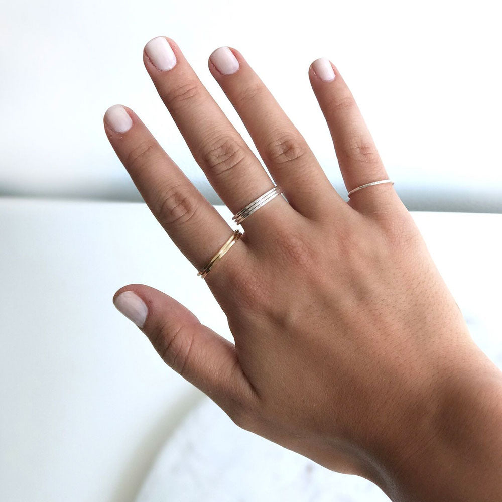Elke Van Dyke Design Gold Stacking Ring Set on model's hand