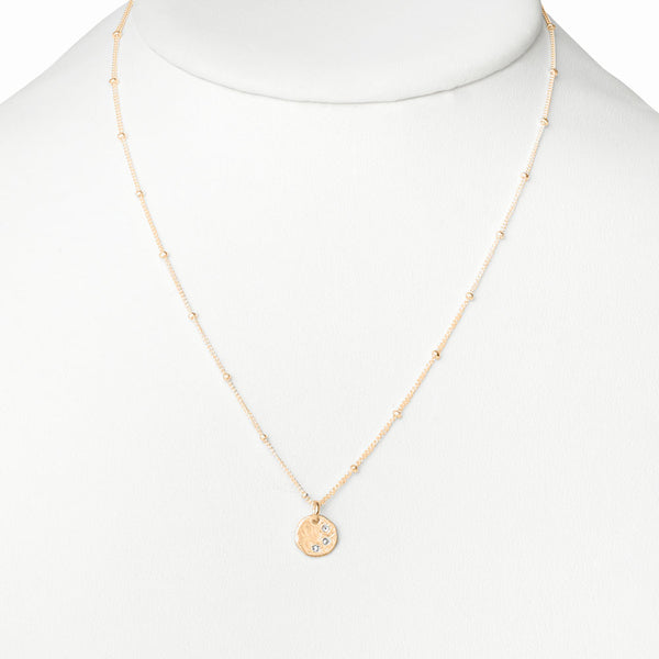 Elke Van Dyke Design Gold Three Wish Necklace on mannequin neck
