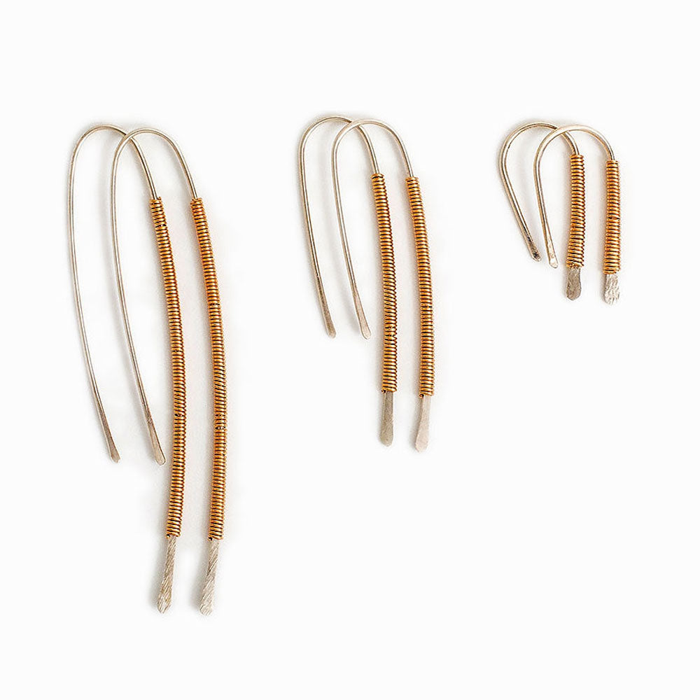 Elke Van Dyke Design Gold Spiralight Silver Threader Earrings laying flat