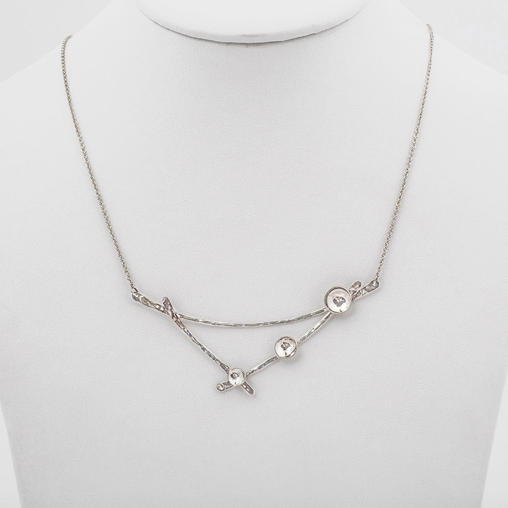 Elke Van Dyke Design Large Silver Moon Lapse Necklace on mannequin neck