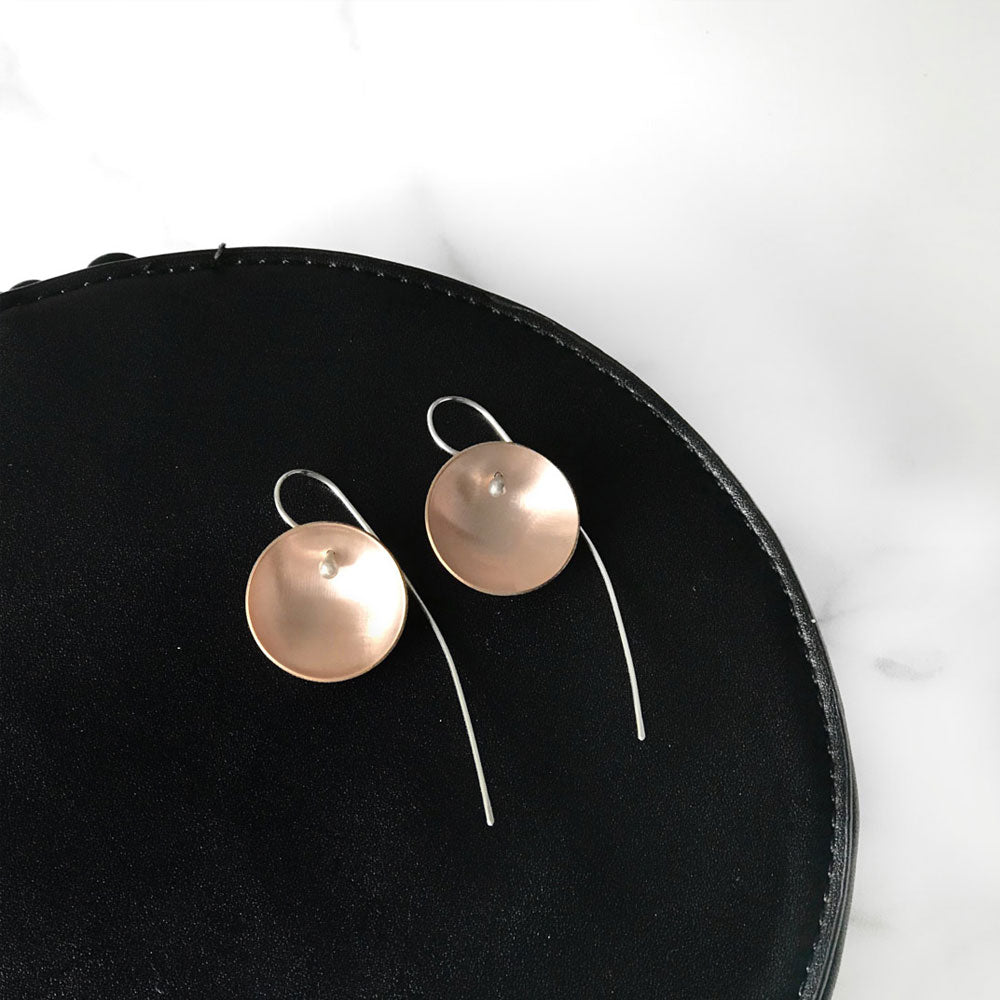 Elke Van Dyke Design Gold Moon Earrings on table