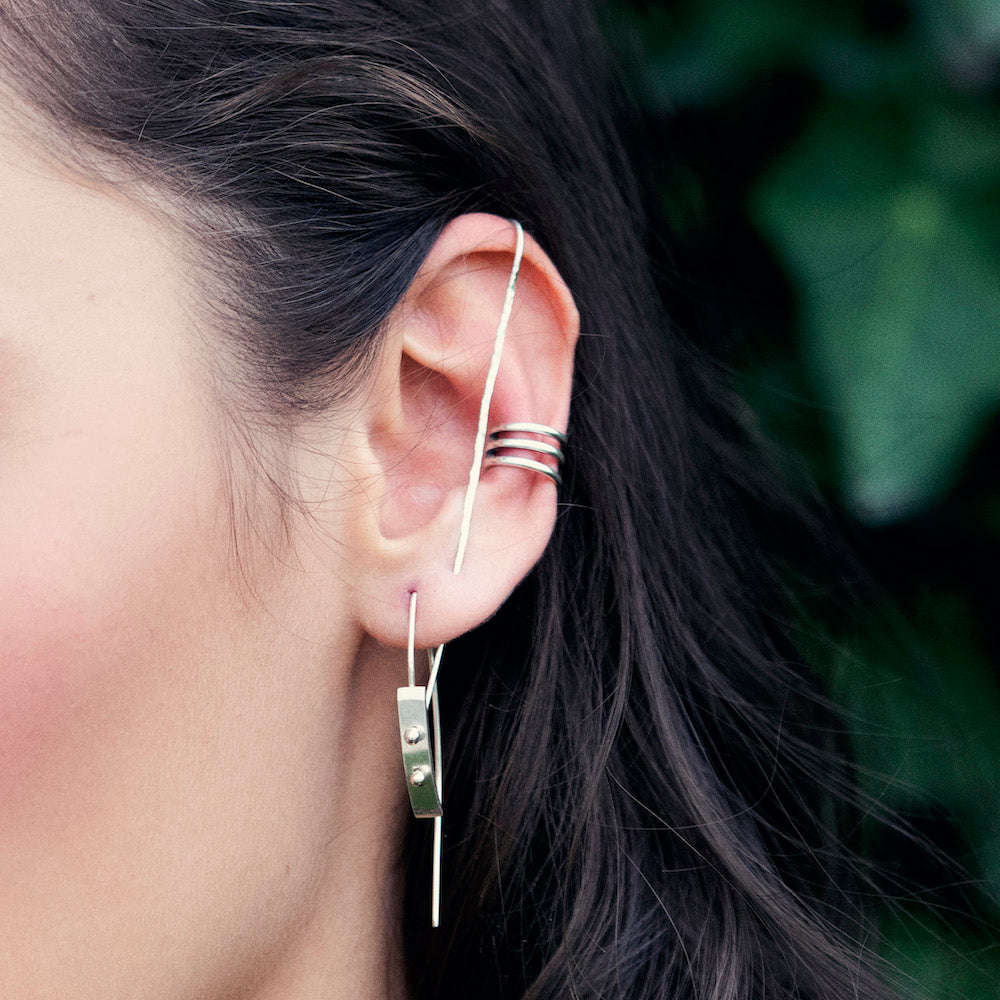 Elke Van Dyke Design Small Silver Moonscape Earrings on model closeup view
