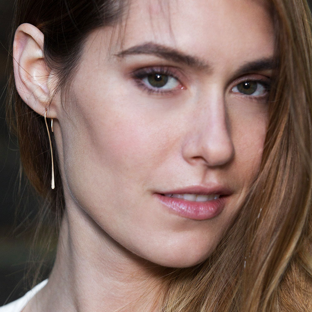 Elke Van Dyke Design Rose Gold Tendril Threader Earrings on model's right ear detail view