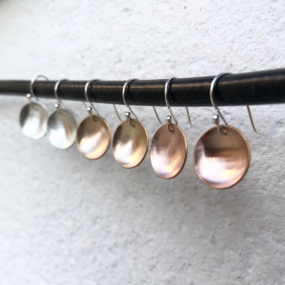 Elke Van Dyke Design Small Rose Gold Moon Earrings on display with other mixed metals